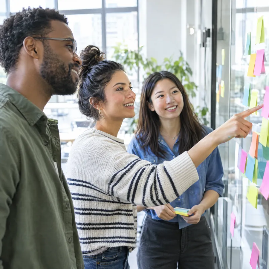 Team planning together at a wall of sticky notes